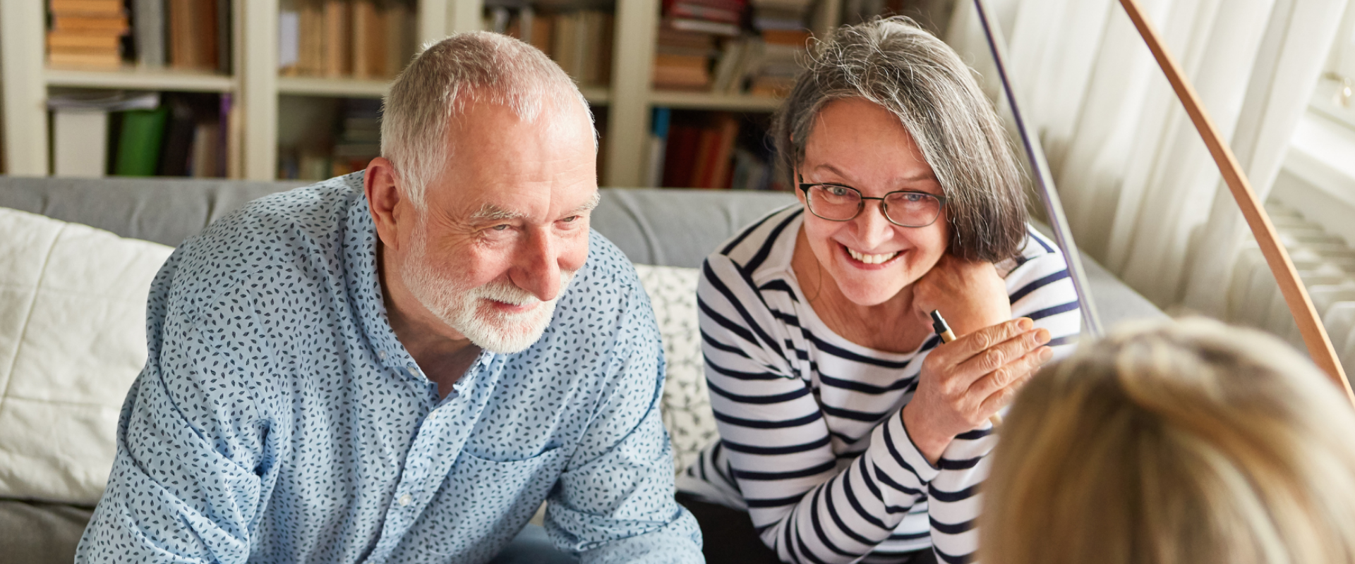 Smiling seniors talking together at home