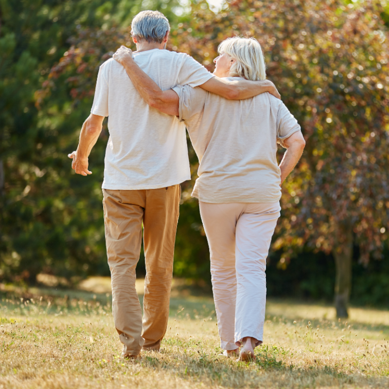Senior couple walking together in the park
